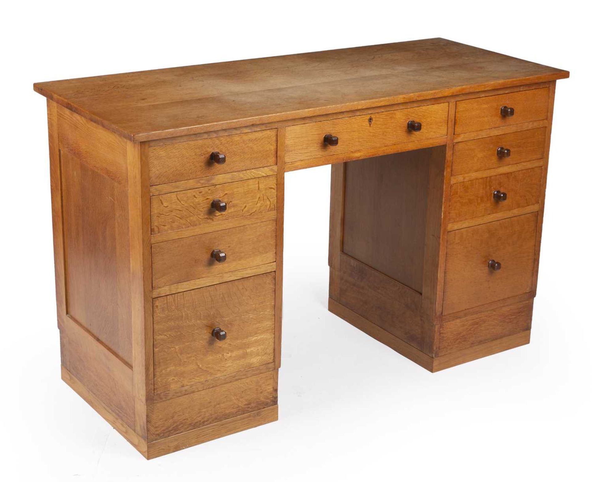 Gordon Russell (1892-1980) Desk, circa 1930 oak, with nine fitted drawers, each with carved - Image 2 of 5