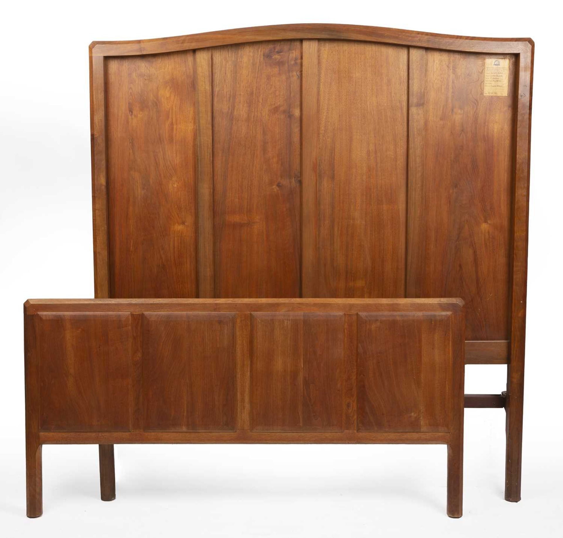 Gordon Russell (1892-1980) Double bed frame English walnut with metal side rails with original paper