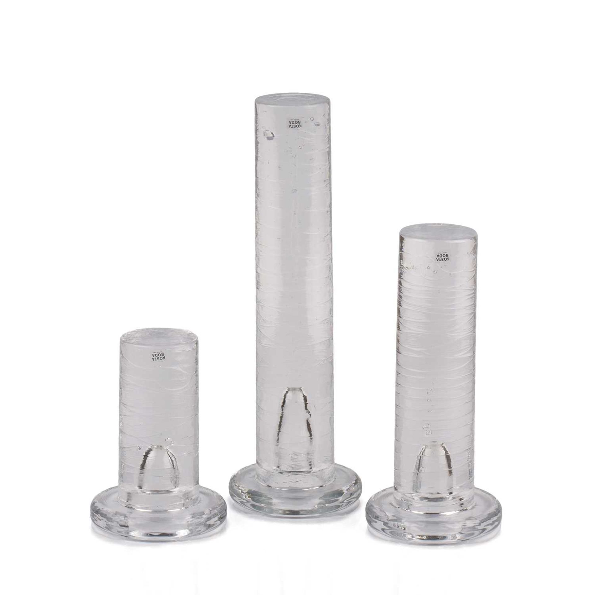 Kosta Boda Three graduated candle holders clear glass the tallest 30cm high.