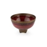 Peter Wills (b.1955) Footed bowl porcelain, with dripped manganese rim and copper red glaze signed