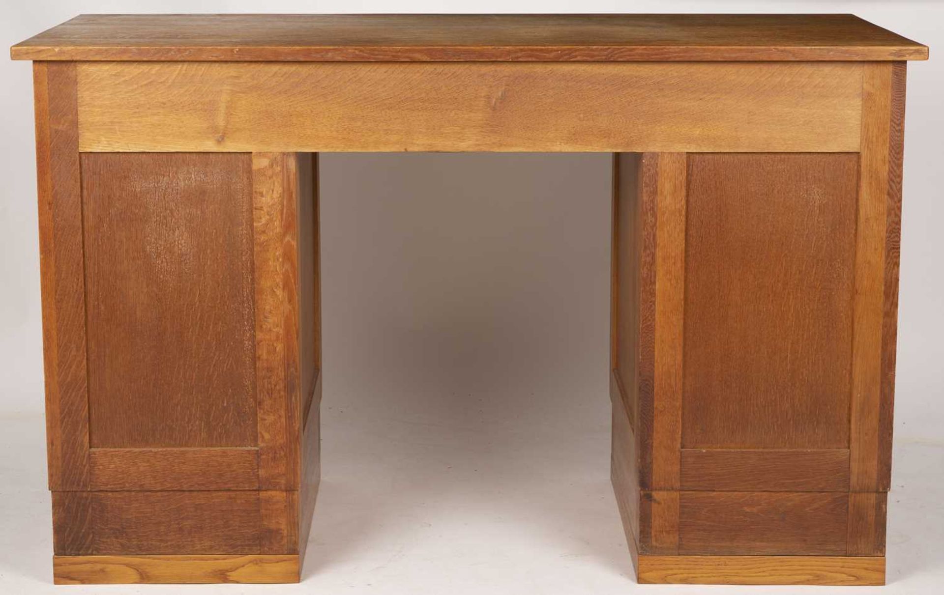 Gordon Russell (1892-1980) Desk, circa 1930 oak, with nine fitted drawers, each with carved - Image 4 of 5