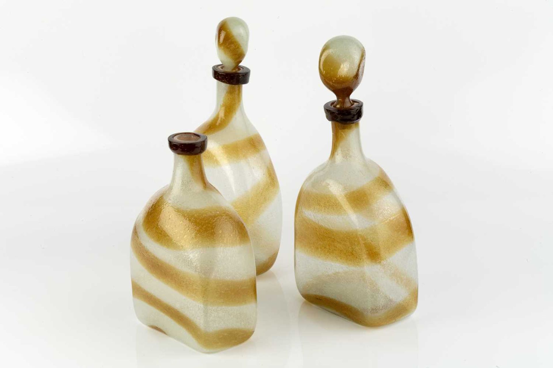Attributed to Arte Vetraria Muranese (AVEM) Three Pulegoso glass bottles, circa 1950 clear and brown - Image 2 of 2