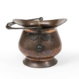 Arts & Crafts Coal scuttle, circa 1910 copper with strapped handle 35cm high.
