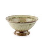 Richard Batterham (1936-2021) Footed bowl stoneware, with green ash glaze 14cm high, 29cm diameter.