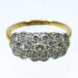 An 18 carat gold diamond cluster ring