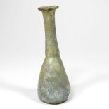 A Roman glass unguent bottle