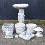 A cast stone bird bath