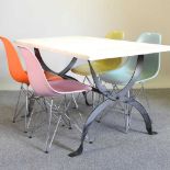 A table and Eames style chairs