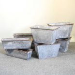 A collection of galvanised planters