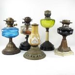 A collection of five oil lamps