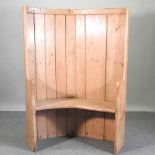 A curved pine settle