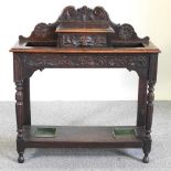 A carved oak hall stand