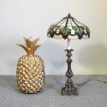 A pineapple and Tiffany style lamp