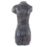 A bronzed torso sculpture