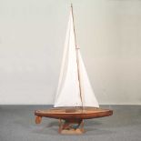 A wooden pond yacht