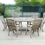 A teak garden table and chairs