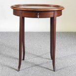 An early 20th century oval bijouterie table