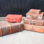 A collection of vintage suitcases and trunk