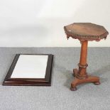 A 19th century rosewood table, with a hardwood mirror