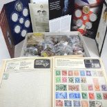 A collection of coins and stamps