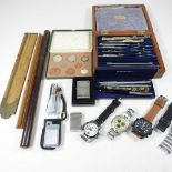 A collection of wristwatches and other items