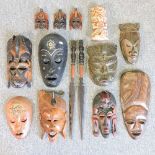 A collection of carved wooden tribal masks