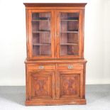 A Victorian walnut cabinet bookcase