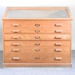 A mid century beech museum chest