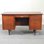 A 1960's teak desk, with plaque for New Scotland Yard