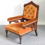 A Victorian oak armchair, with angled supports