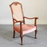 An early 20th century cane back armchair