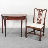 A George III satinwood inlaid card table and chair