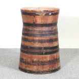 An antique coopered wooden barrel