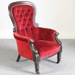 A Victorian red upholstered armchair