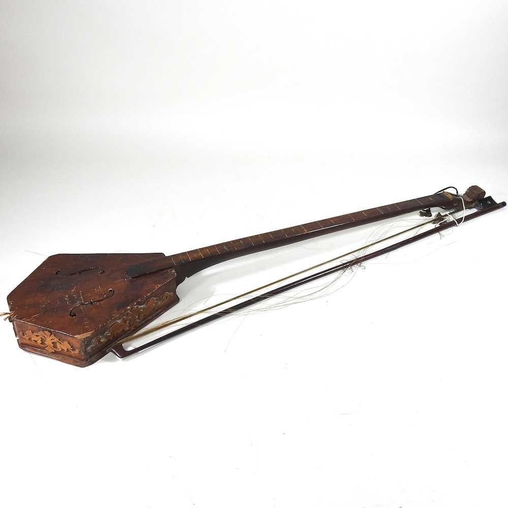 A one string fiddle and bow