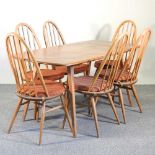 An Ercol light elm table and chairs