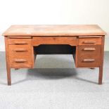 A mid 20th century light oak desk