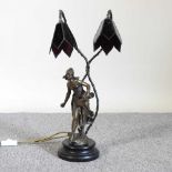 A bronzed twin branch figural table lamp
