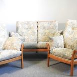 An Ercol light elm three-piece suite