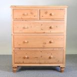 A pine chest of drawers