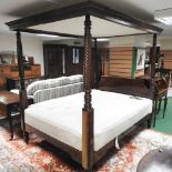 A mid 20th century mahogany four poster bed