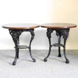 A pair of cast iron pub tables