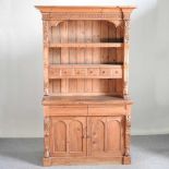 A carved pine dresser