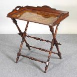 A reproduction yew wood butler's tray