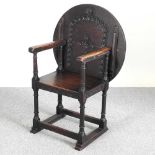 An early 20th century carved oak monk's seat