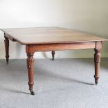 A 19th century mahogany dining table