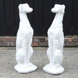 A pair of stone greyhounds