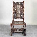 A Carolean style carved walnut chair