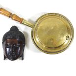 A bronzed mask and warming pan