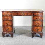 A reproduction pedestal desk